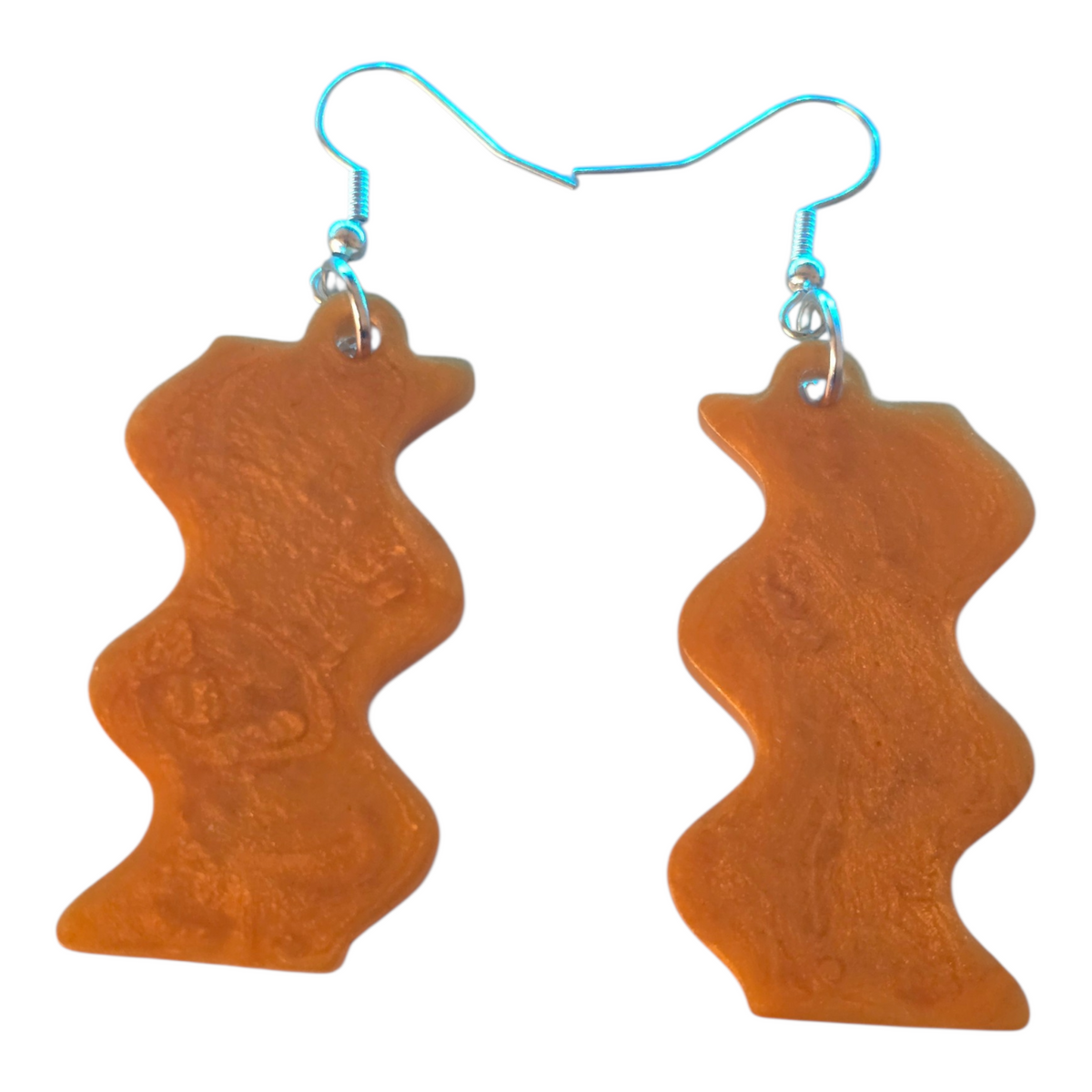 Love For Resin wavy dangle earrings in amber resin with a shimmering swirl and silver-tone hooks