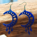 Love For Resin celestial moon phase dangle earrings in translucent blue acrylic with geometric charms